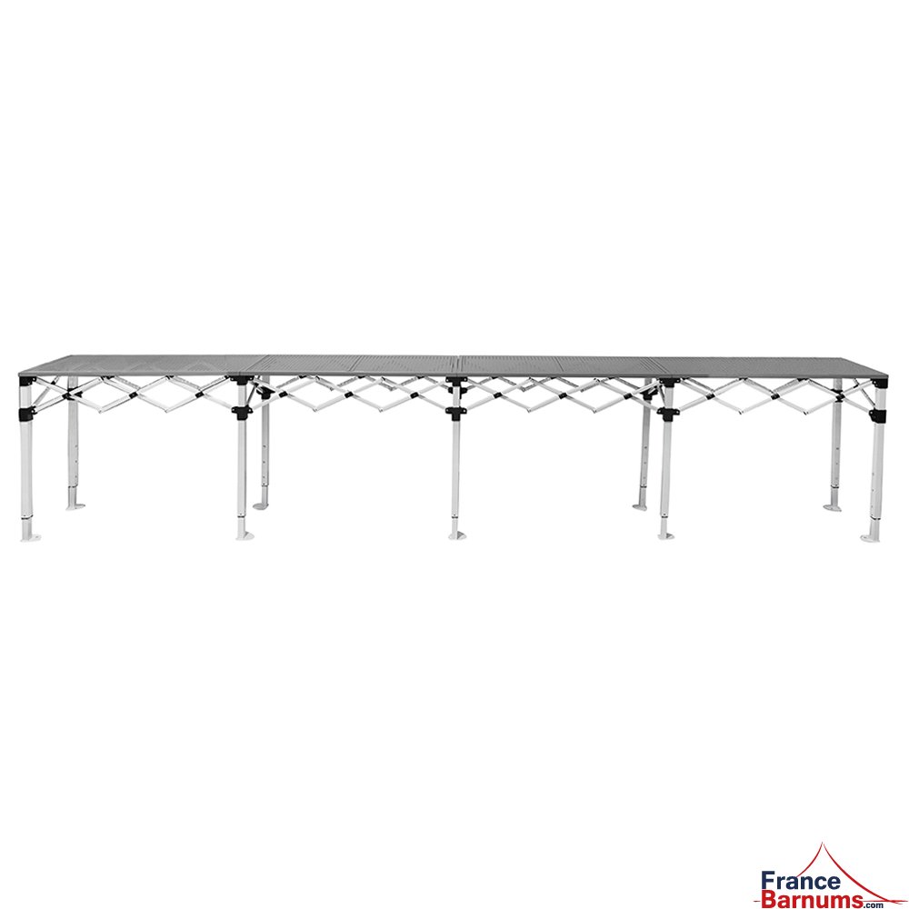 Table Comptoir Pliante acier 4m avec plateaux ajourés sur 2 niveaux de 40cm Table Comptoir Pliante acier 4m avec plateaux ajourés sur 2 niveaux de 40cm